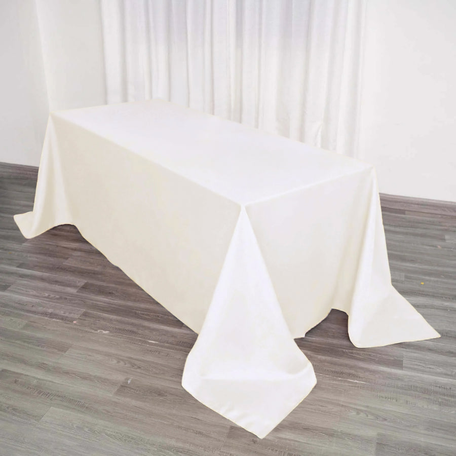 90"x132" Ivory Polyester Rectangular Tablecloth