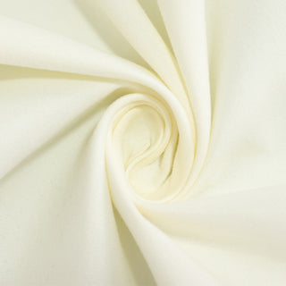 Cream cotton fabric swirl texture close-up.