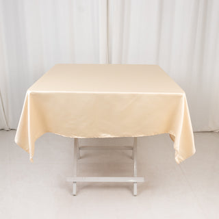 <strong>Exquisite Beige Lamour Satin Tablecloth - 54"</strong> <strong>Exquisite Beige Lamour Satin Tablecloth - 54"</strong>