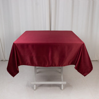 <strong>Exquisite Burgundy Lamour Satin Tablecloth - 54"</strong> <strong>Exquisite Burgundy Lamour Satin Tablecloth - 54"</strong>