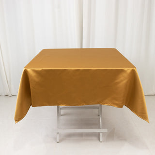 <strong>Exquisite Gold Lamour Satin Tablecloth - 54"</strong> <strong>Exquisite Gold Lamour Satin Tablecloth - 54"</strong>