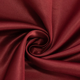 Rich burgundy satin fabric with a smooth texture.
