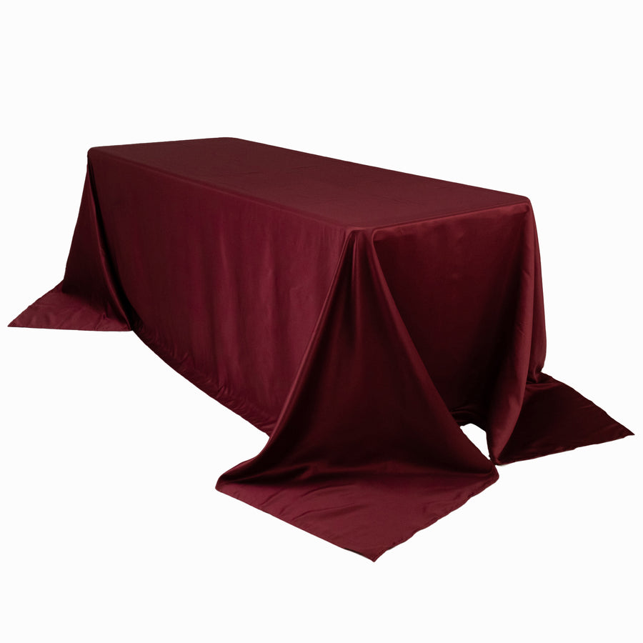 Burgundy tablecloth draped over a rectangular table