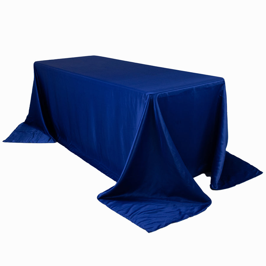 Blue tablecloth draped over a rectangular table, showcasing elegant fabric texture.