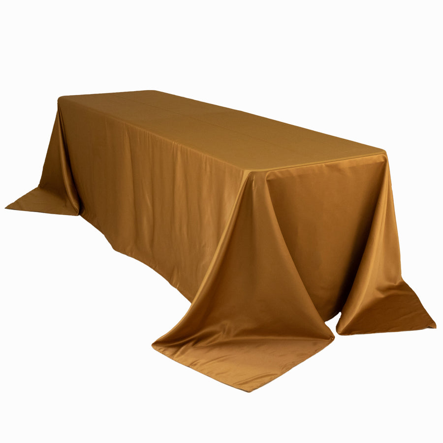 Gold tablecloth draped elegantly over a rectangular table