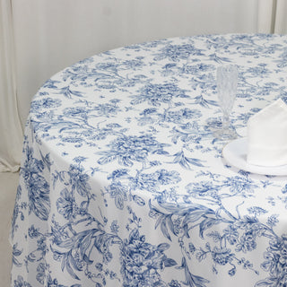 Floral blue and white tablecloth on a round table setting