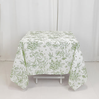 Floral-patterned tablecloth on a white table against a plain backdrop