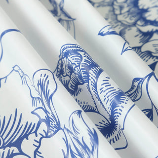 Blue floral patterned fabric draped elegantly. #whtbkgd