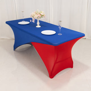 Blue and red table cover with plates and glasses on a table.