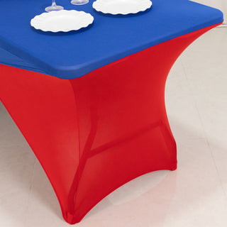 Red and blue table cover with plates on a table