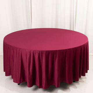 <strong>Premium 108" Round Burgundy Scuba Tablecloth</strong> <strong>Premium 108" Round Burgundy Scuba Tablecloth</strong>
