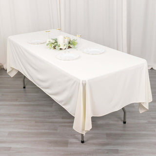 Experience Luxury and Convenience with the Ivory Premium Scuba Wrinkle Free Rectangular Tablecloth Experience Luxury and Convenience with the Ivory Premium Scuba Wrinkle Free Rectangular Tablecloth