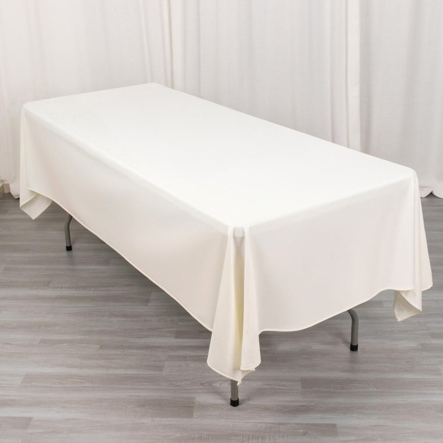 White tablecloth draped over a table in a studio setting