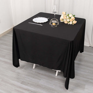 Make a Statement with the 70" Black Premium Scuba Wrinkle Free Square Tablecloth Make a Statement with the 70" Black Premium Scuba Wrinkle Free Square Tablecloth