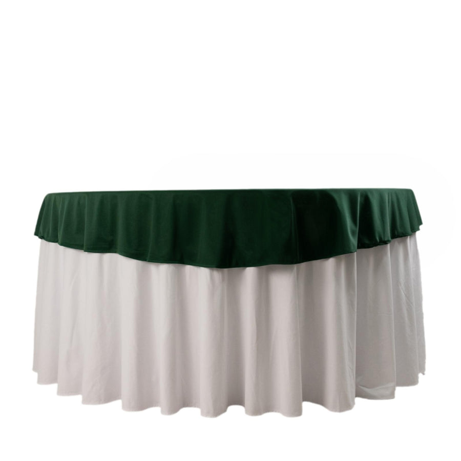Round table with green and white tablecloth