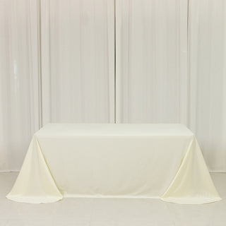 <strong>Ivory Scuba Polyester Tablecloth 90"x132" Rounded Corner Design</strong> <strong>Ivory Scuba Polyester Tablecloth 90"x132" Rounded Corner Design</strong>