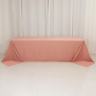 Peach tablecloth draped elegantly on a table in a studio setting.