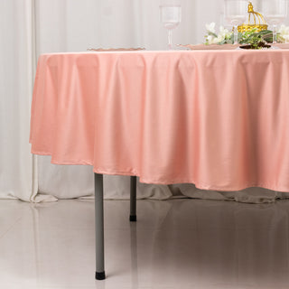 Pink tablecloth draped elegantly over a table in a styled setting.