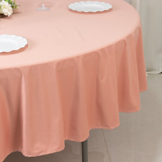 Peach round tablecloth draping elegantly over a table