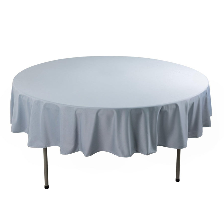 Round table with white tablecloth in studio isolation shot