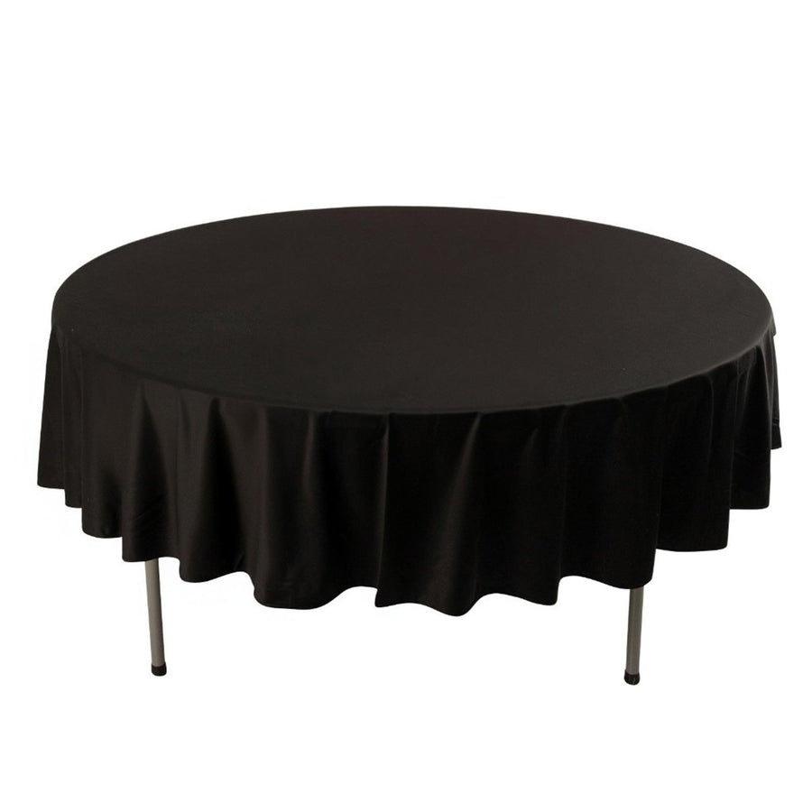 Round black table with a fitted tablecloth, showcasing a smooth finish.