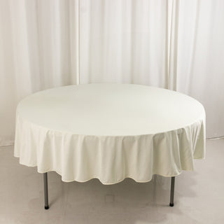 <strong>90" Round Ivory Scuba Tablecloth</strong> <strong>90" Round Ivory Scuba Tablecloth</strong>