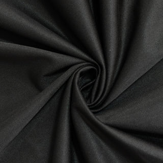 Black fabric texture in a swirling pattern. #whtbkgd
