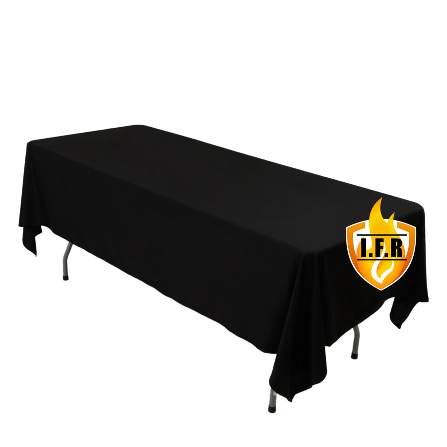 Black tablecloth draped over folding banquet table