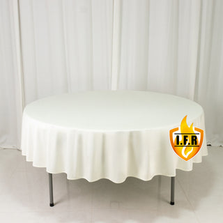 White round tablecloth with elegant drape.