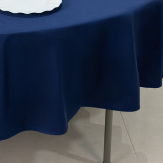 Navy blue tablecloth draping elegantly over a round table.
