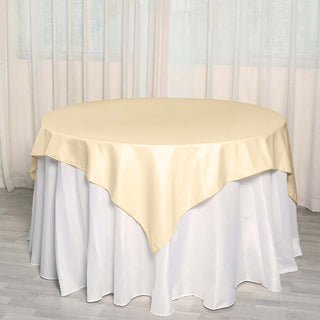 Elevate Your Event Decor with the Beige Square Polyester Table Overlay Elevate Your Event Decor with the Beige Square Polyester Table Overlay