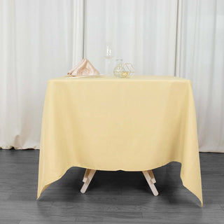 Experience Elegance with the 70"x70" Champagne Premium Polyester Square Tablecloth Experience Elegance with the 70"x70" Champagne Premium Polyester Square Tablecloth