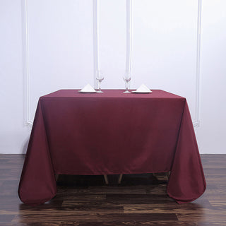 Add Elegance to Your Event with the Burgundy Seamless Square Polyester Tablecloth