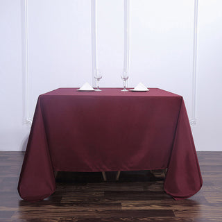 Add Elegance to Your Event with the Burgundy Square Polyester Tablecloth Add Elegance to Your Event with the Burgundy Square Polyester Tablecloth