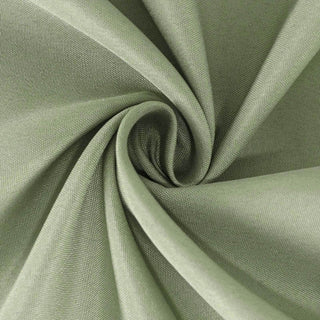 Green fabric swirl texture shot for sewing or crafting projects.