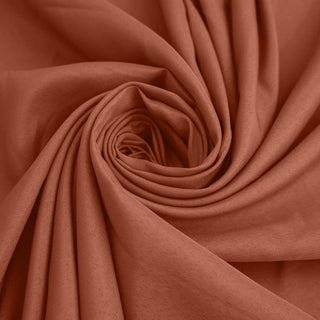 Textured rust fabric in a swirling pattern. #whtbkgd