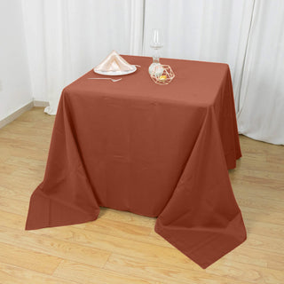 Elevate Your Event with the Terracotta (Rust) Square Polyester Tablecloth Elevate Your Event with the Terracotta (Rust) Square Polyester Tablecloth