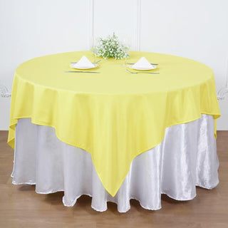 Make a Statement with the 90"x90" Yellow Square Polyester Table Overlay Make a Statement with the 90"x90" Yellow Square Polyester Table Overlay