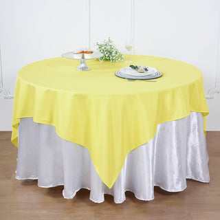 Add Elegance to Your Event with the 90"x90" Yellow Square Polyester Table Overlay Add Elegance to Your Event with the 90"x90" Yellow Square Polyester Table Overlay