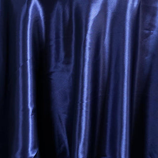Navy satin fabric drape with a smooth, glossy finish.