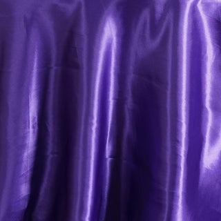 Purple satin fabric with smooth texture and elegant sheen.