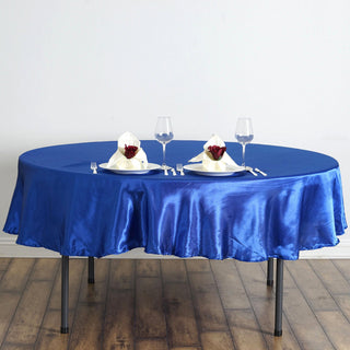 Add Elegance to Your Event with the 90" Royal Blue Satin Tablecloth Add Elegance to Your Event with the 90" Royal Blue Satin Tablecloth