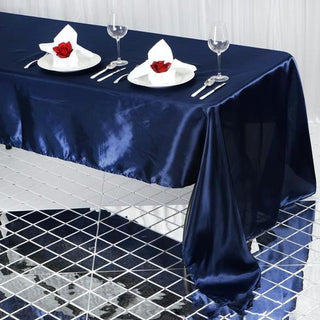 Elegant navy tablecloth set for a romantic dining experience.