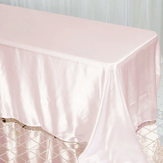 Make a Lasting Impression with the Blush Satin Seamless Rectangular Tablecloth Make a Lasting Impression with the Blush Satin Seamless Rectangular Tablecloth