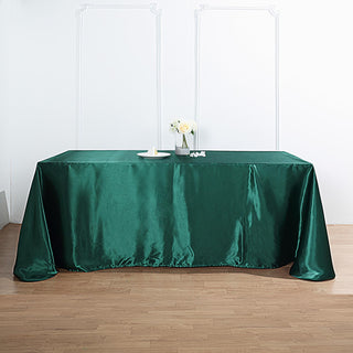 Dress Your Tables in Elegance with the 90"x132" Hunter Emerald Green Satin Seamless Rectangular Tablecloth Dress Your Tables in Elegance with the 90"x132" Hunter Emerald Green Satin Seamless Rectangular Tablecloth