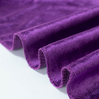 Purple rolled fabric texture close-up on white background