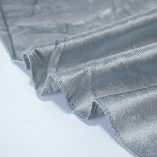 Gray velvet fabric swatches with soft folded texture and stitched edges