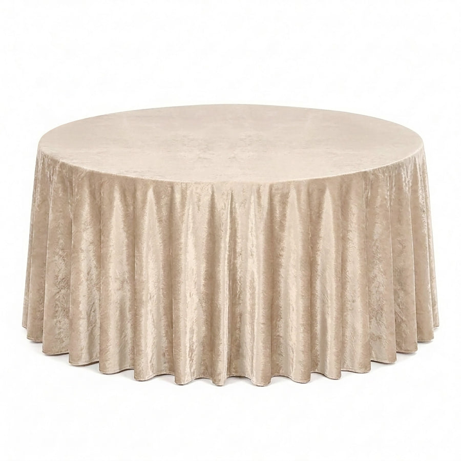 Round beige velvet tablecloth with floor-length drape on banquet table