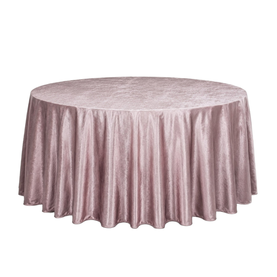 Round blush pink velvet tablecloth on a banquet table