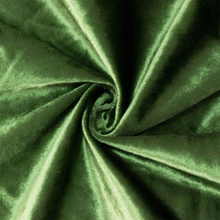Green velvet fabric texture with swirl folds and glossy sheen#whtbkgd